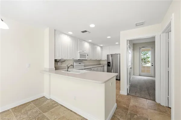 a view of a kitchen with a sink