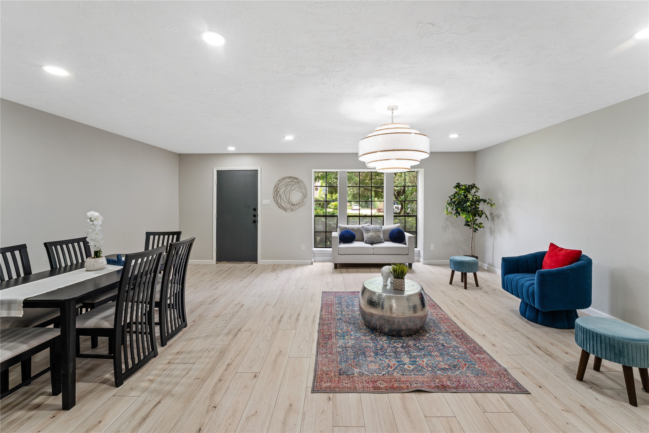 9425 Fondren Road Houston, TX 77074 - Photo 6 of 29 Another view of the living - dining area from the kitchen,. The huge window overlooking the front of the home brings lots of natural light to this space.