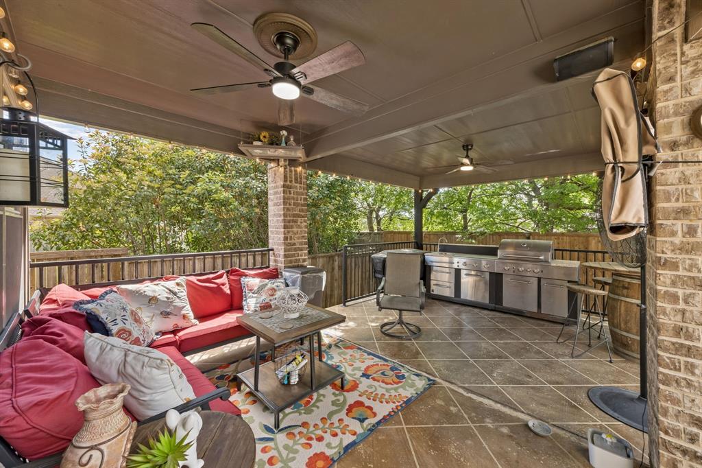 8104 Red Riv Run North Richland Hills, TX 76180 - Photo 35 of 38 a roof deck with table and chairs and a barbeque