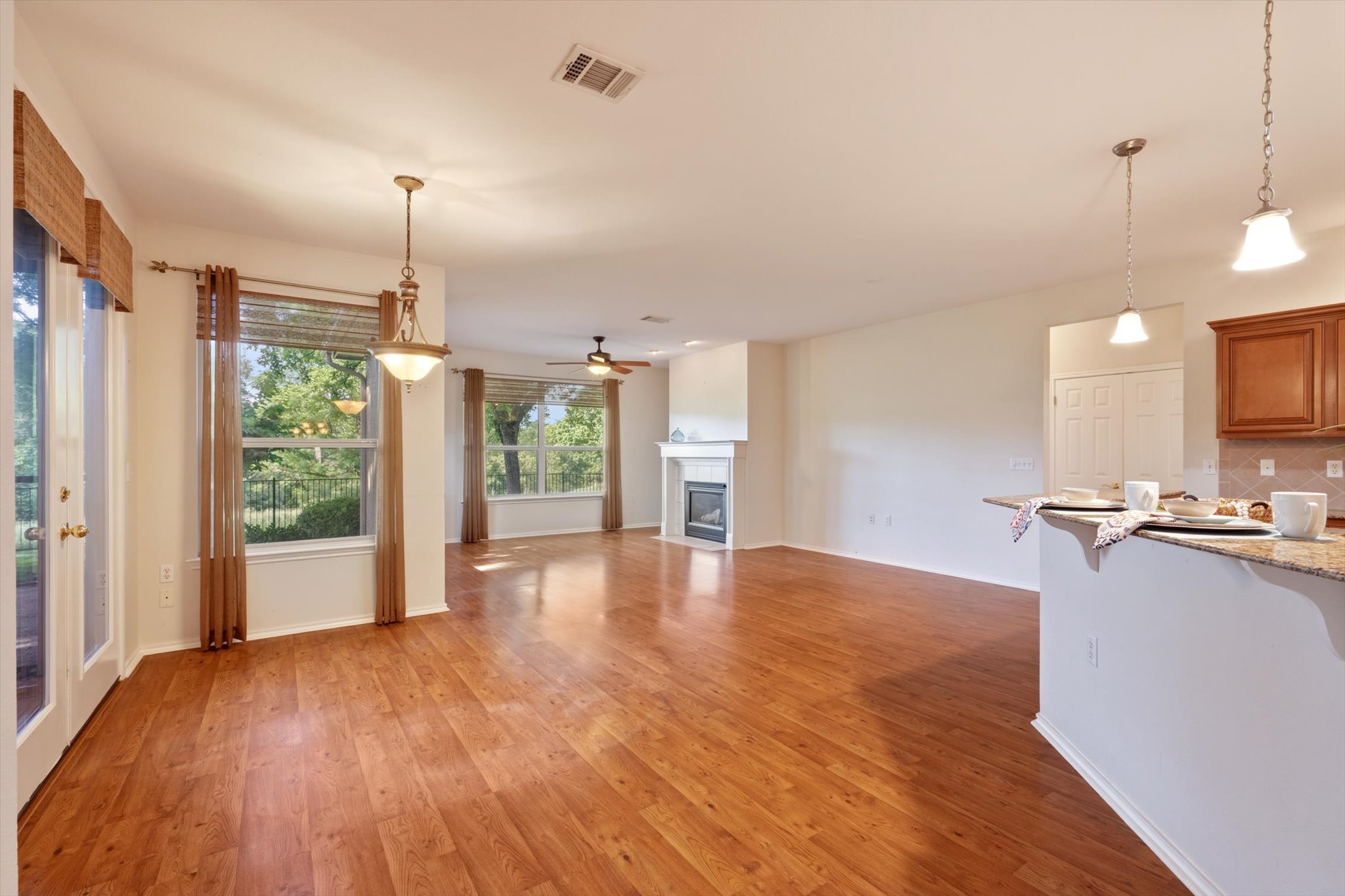 126 Trail Rider Way Georgetown, TX 78633 - Photo 7 of 30 a view of a kitchen with a sink and a wooden floor