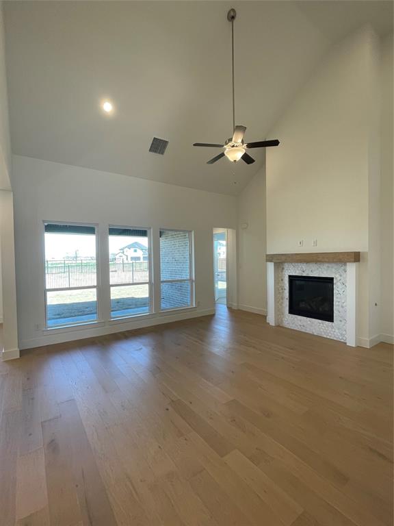 2124 Ten Mile Crk Road Celina, TX 75009 - Photo 11 of 30 a view of a livingroom with a fireplace and a window