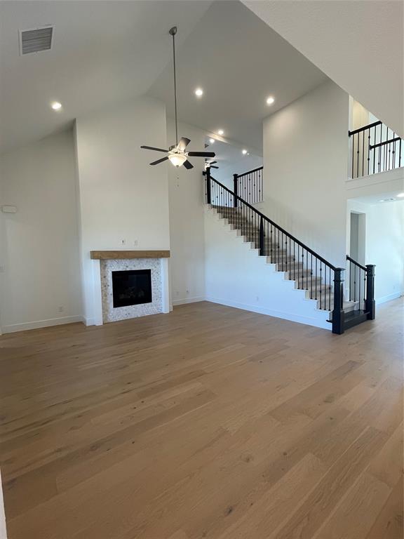 2124 Ten Mile Crk Road Celina, TX 75009 - Photo 12 of 30 a view of an empty room with a fireplace and a chandelier