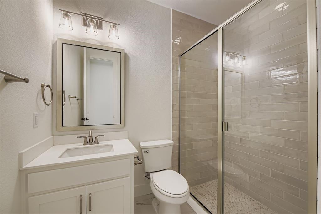 2124 Ten Mile Crk Road Celina, TX 75009 - Photo 20 of 30 a bathroom with a sink toilet and shower