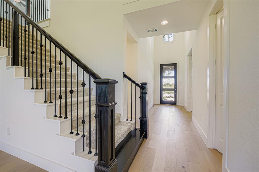2124 Ten Mile Crk Road Celina, TX 75009 - Photo 4 of 30 a view of a hallway with wooden floor and staircase