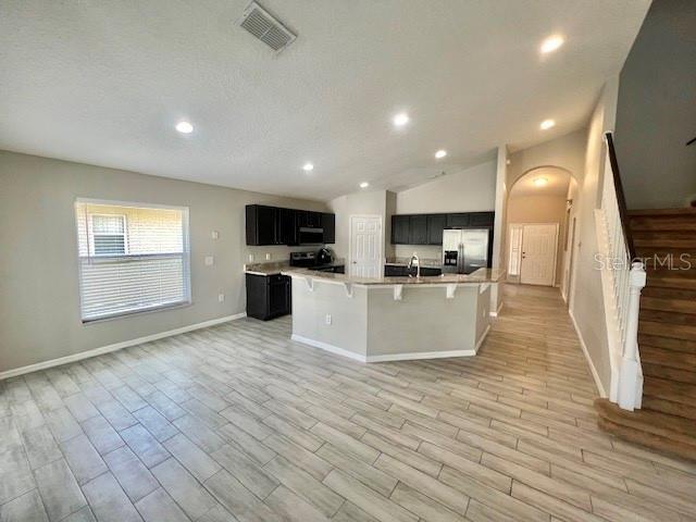 2749 Callaway Lane Kissimmee, FL 34744 - Photo 11 of 30 a view of kitchen with microwave refrigerator and cabinets