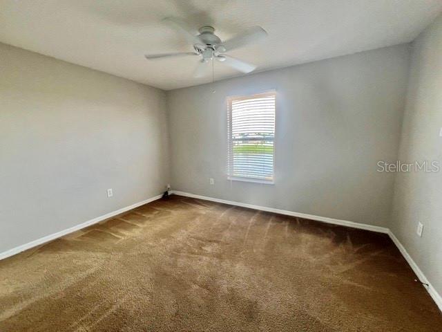 2749 Callaway Lane Kissimmee, FL 34744 - Photo 19 of 30 an empty room with a window