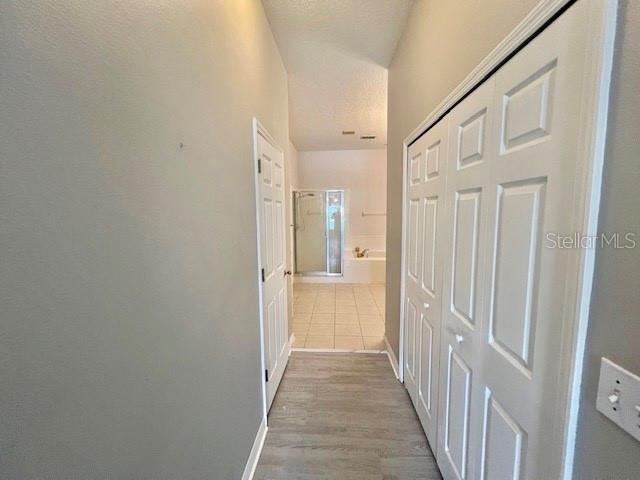 2749 Callaway Lane Kissimmee, FL 34744 - Photo 20 of 30 a view of a hallway with a wooden door
