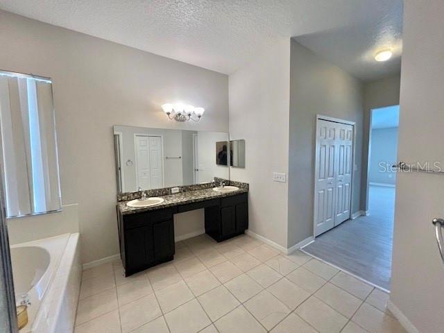 2749 Callaway Lane Kissimmee, FL 34744 - Photo 22 of 30 a large kitchen with a stove a refrigerator and a sink