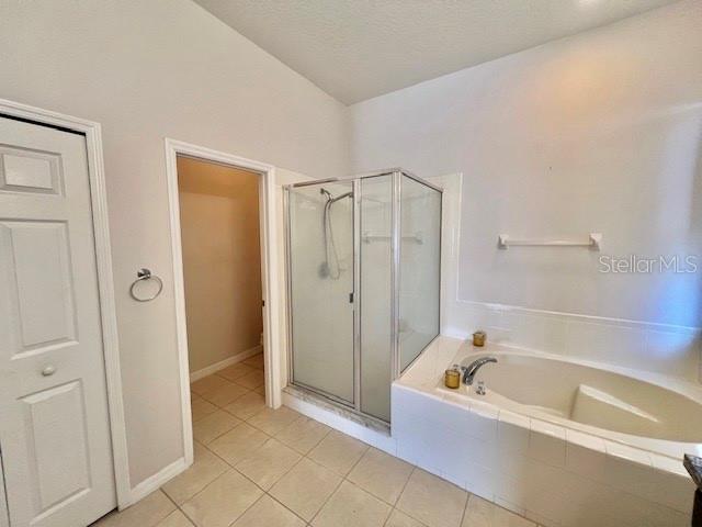 2749 Callaway Lane Kissimmee, FL 34744 - Photo 24 of 30 a bathroom with a bathtub and a shower
