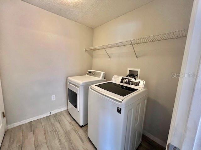 2749 Callaway Lane Kissimmee, FL 34744 - Photo 29 of 30 a utility room with dryer and washer