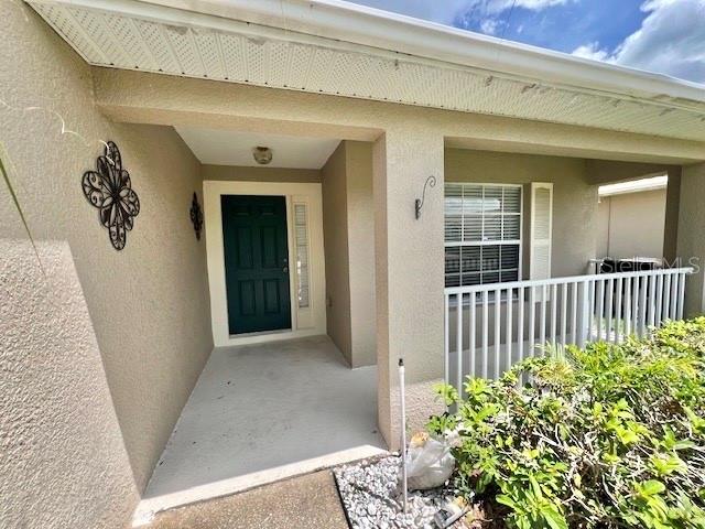 2749 Callaway Lane Kissimmee, FL 34744 - Photo 4 of 30 a view of a porch with a door