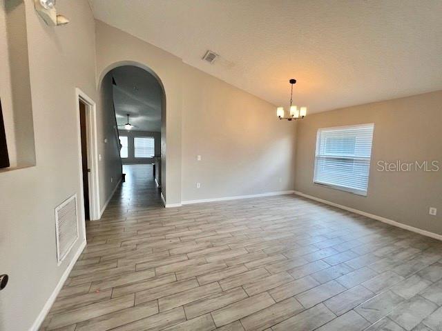2749 Callaway Lane Kissimmee, FL 34744 - Photo 5 of 30 wooden floor in an empty room with a mirror