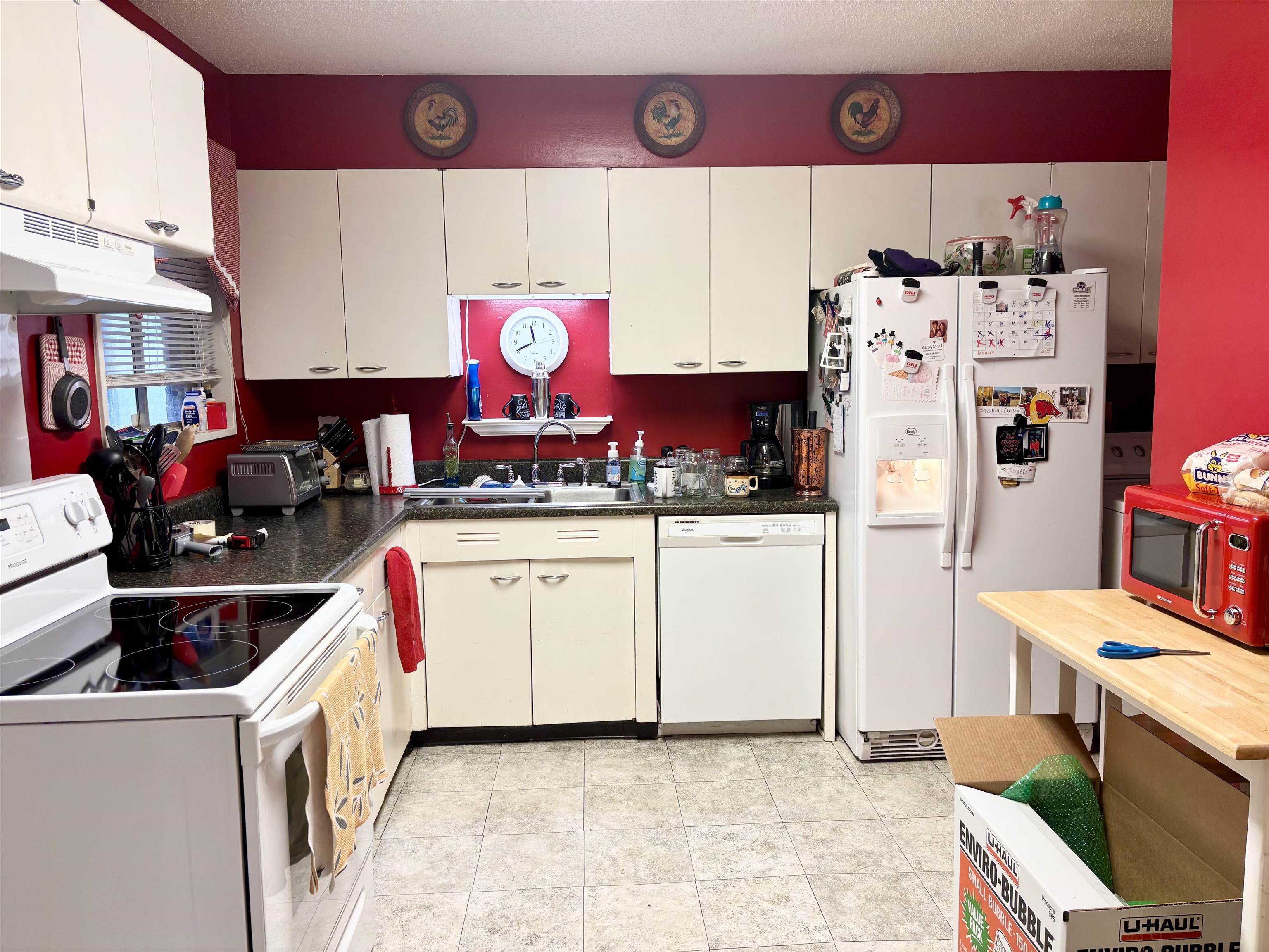 496 Chalmers Road Memphis, TN 38120 - Photo 7 of 20 Kitchen with white cabinetry, white appliances, sink, and light tile patterned floors