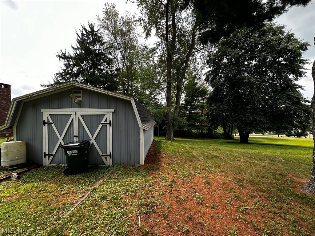2093 Cambridge Road Coshocton, OH 43812 - Photo 32 of 32 View of outbuilding with a yard