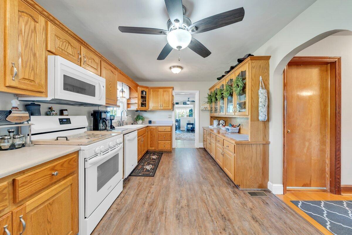 3226 Rakes Road Rocky Mount, VA 24151 - Photo 23 of 74 a large kitchen with stainless steel appliances granite countertop a lot of counter space and wooden floor