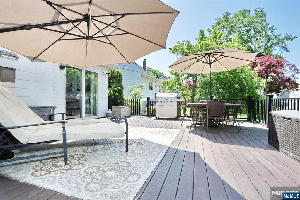 30 Brookfield Road Dumont, NJ 07628 - Photo 34 of 50 a view of a dinning table and chairs in the patio