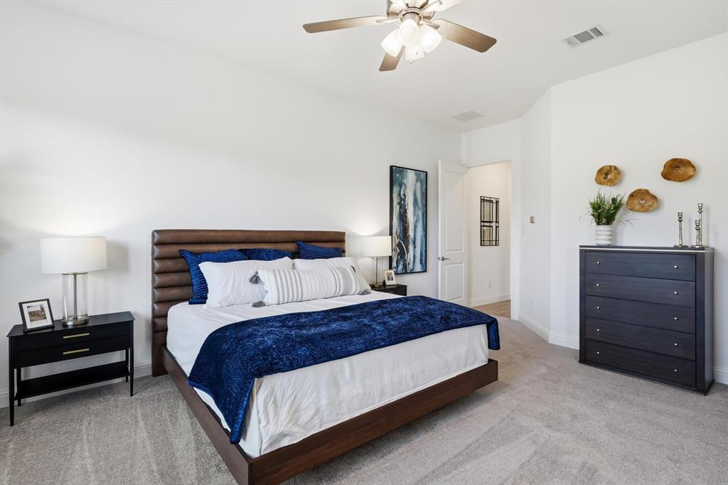 4017 Eagles Bluff Road Midlothian, TX 76065 - Photo 9 of 38 Spacious bedroom featuring light grey carpeting, white walls, and a ceiling fan with integrated lighting
