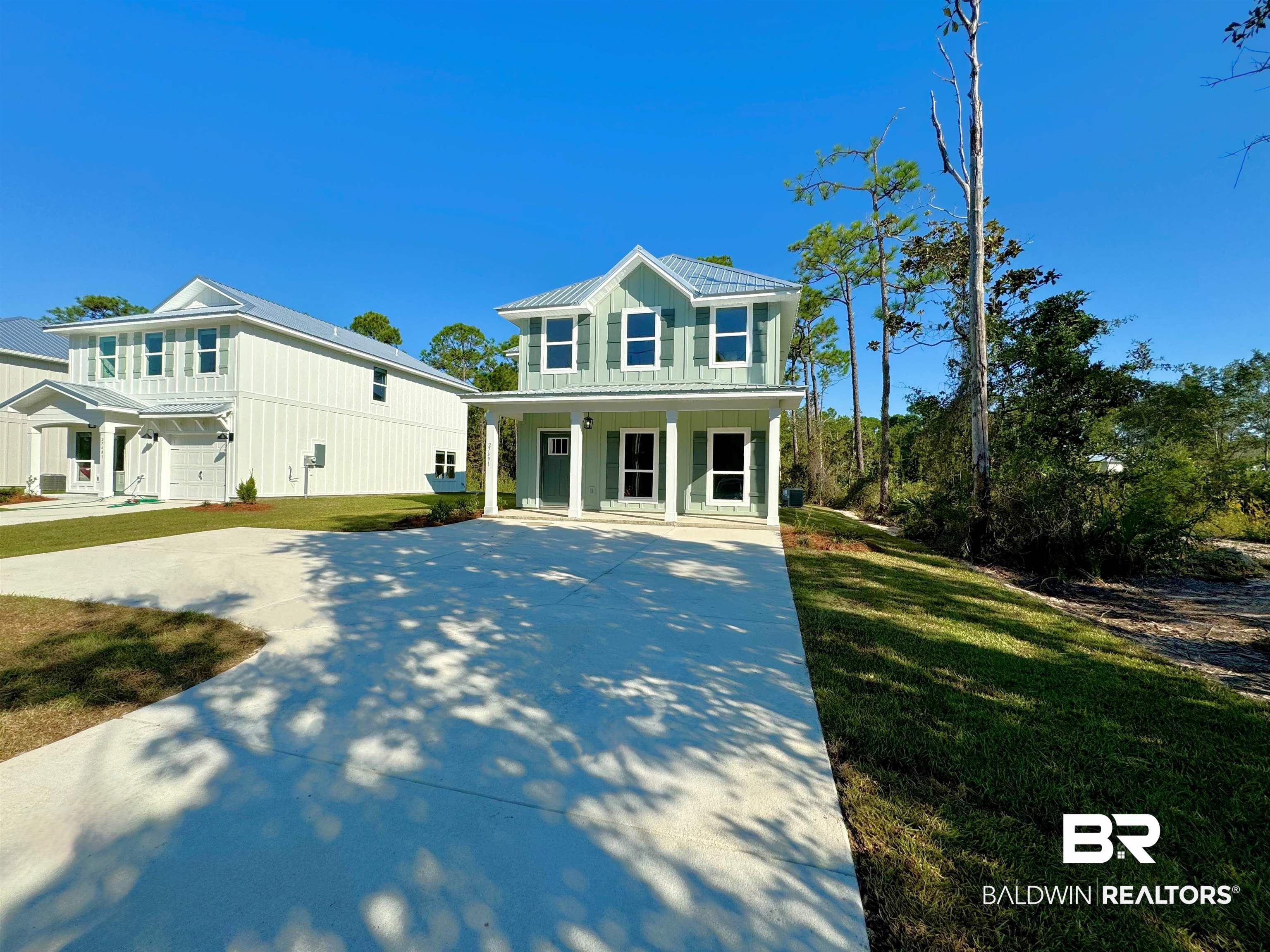 27491 Canal Road Orange Beach, AL 36561 - Photo 3 of 20 View of front of home with a front yard, a porch, and a carport