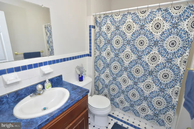 a kitchen with stainless steel appliances granite countertop a stove cabinets and a sink