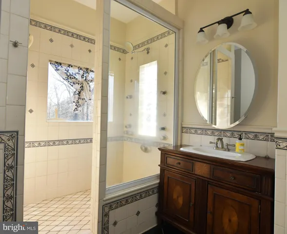 a white toilet sitting next to a bathroom sink