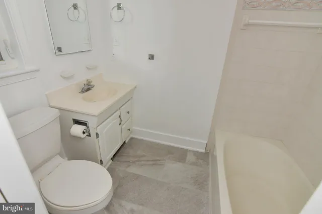 a view of a hallway with staircase