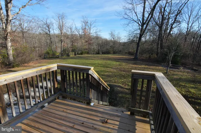 a view of a porch with wooden floor