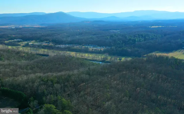 a view of a porch with wooden floor in front of glass door