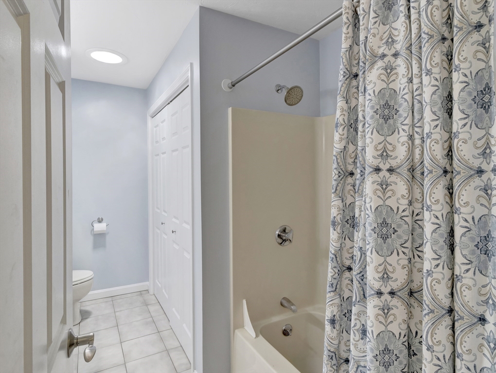 13 Shawmut Avenue, Unit 13 Mansfield, MA 02048 - Photo 18 of 34 a bathroom with a bathtub and a shower