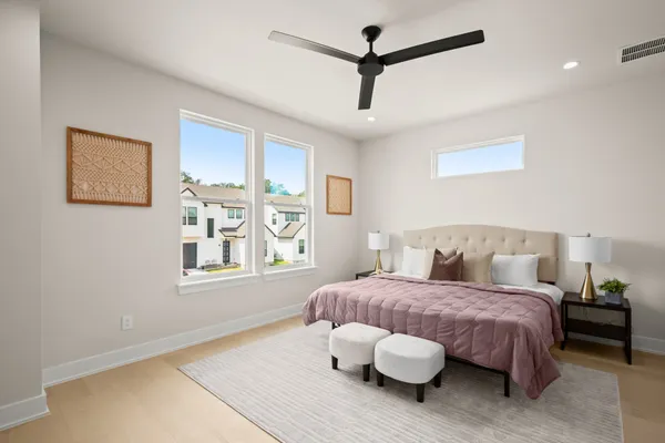 a bedroom with a bed and a window