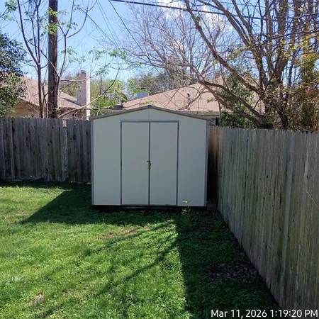 a view of backyard with green space