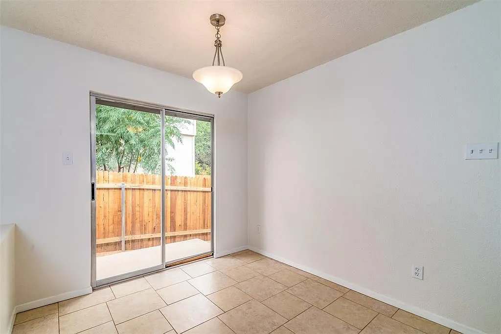 7229 Aldea Drive, Unit B Austin, TX 78745 - Photo 3 of 13 a view of an empty room with a window