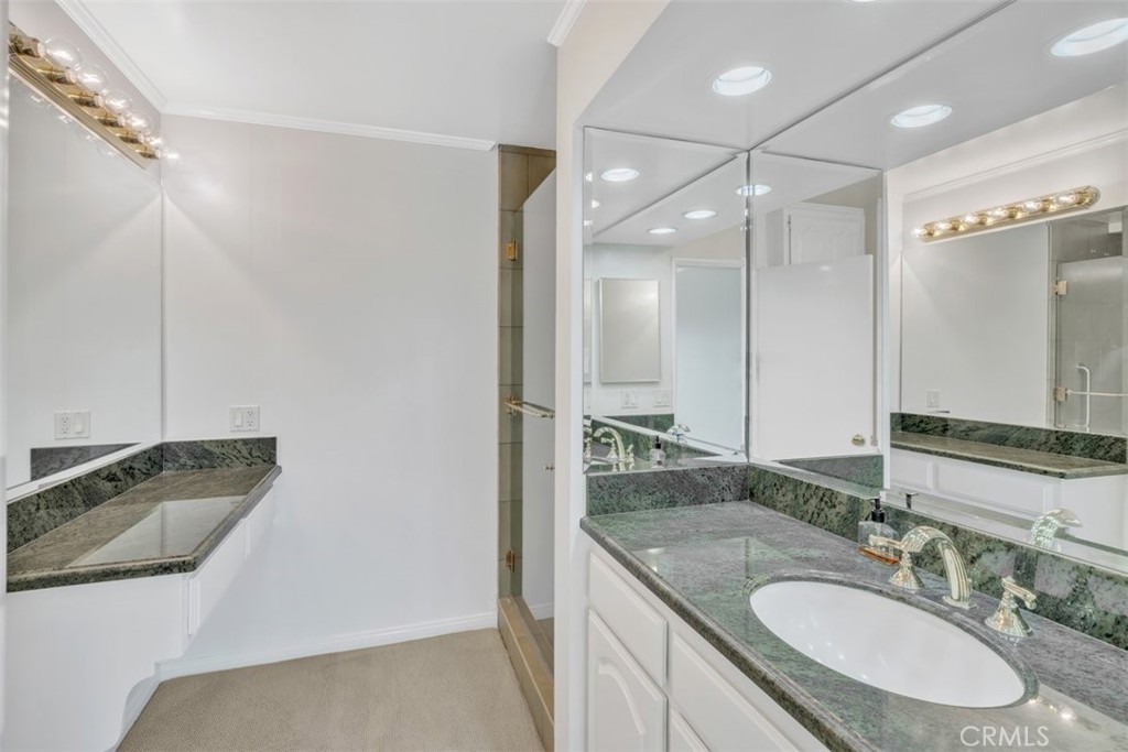 5441 Burning Tree Drive La Canada Flintridge, CA 91011 - Photo 14 of 32 a bathroom with a sink double vanity and a mirror