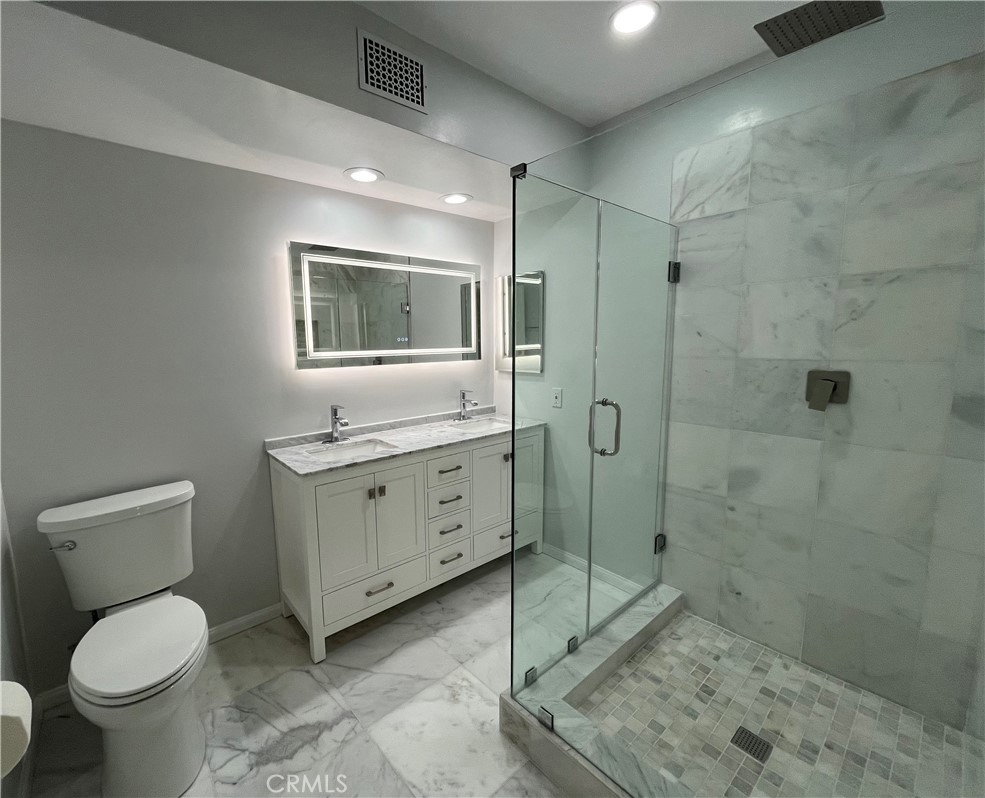 5441 Burning Tree Drive La Canada Flintridge, CA 91011 - Photo 19 of 32 a bathroom with a toilet sink and shower