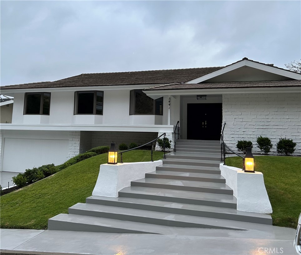 5441 Burning Tree Drive La Canada Flintridge, CA 91011 - Photo 2 of 32 a view of a house with a swimming pool