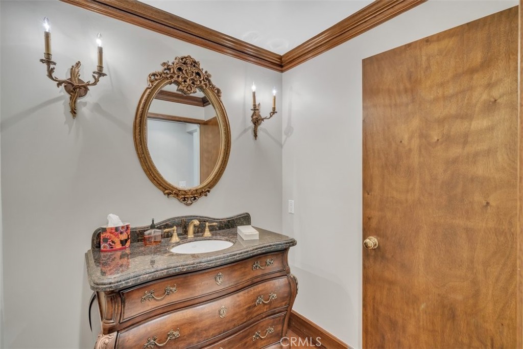 5441 Burning Tree Drive La Canada Flintridge, CA 91011 - Photo 26 of 32 a bathroom with a sink mirror and vanity