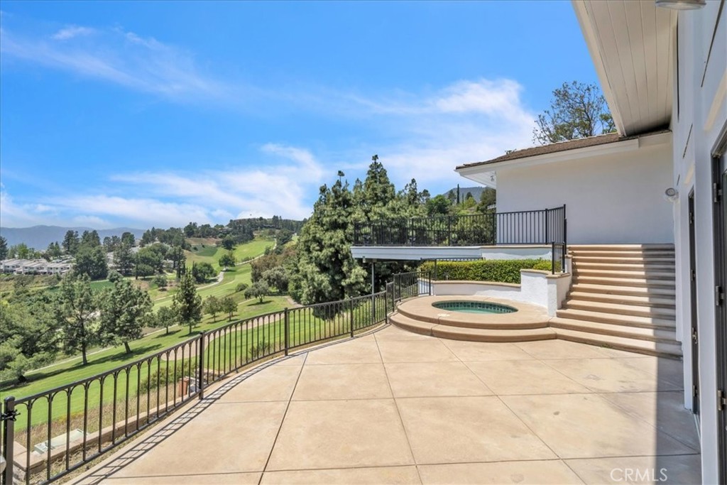 5441 Burning Tree Drive La Canada Flintridge, CA 91011 - Photo 31 of 32 a view of a balcony with chair and wooden floor