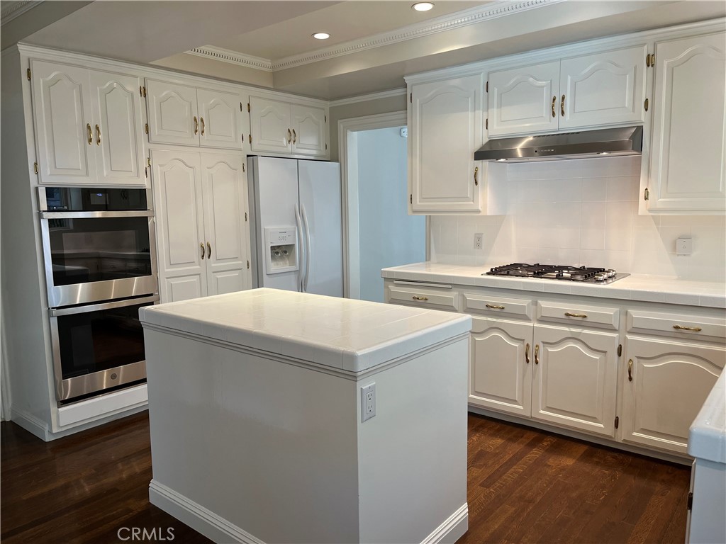 5441 Burning Tree Drive La Canada Flintridge, CA 91011 - Photo 10 of 32 a kitchen with cabinets and steel stainless steel appliances