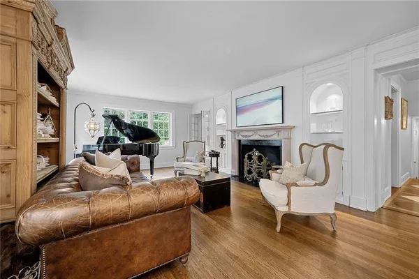 a living room with furniture or fireplace and a wooden floor