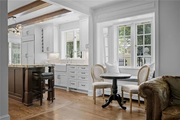 a view of a workspace with furniture and windows
