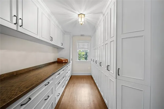 a view of a hallway with stairs