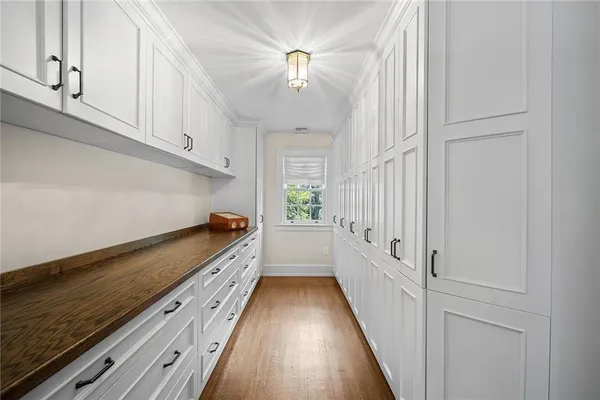 a view of a hallway with stairs