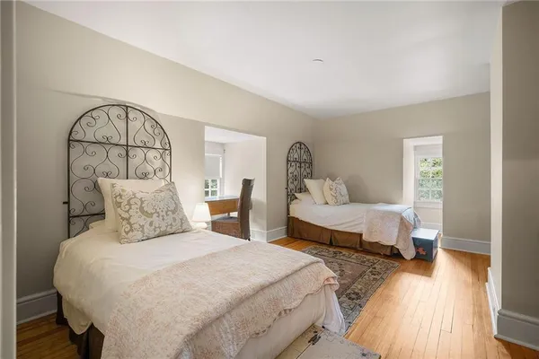 a bedroom with double bed and a window