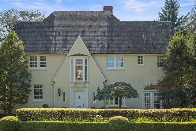 front view of a house with a garden