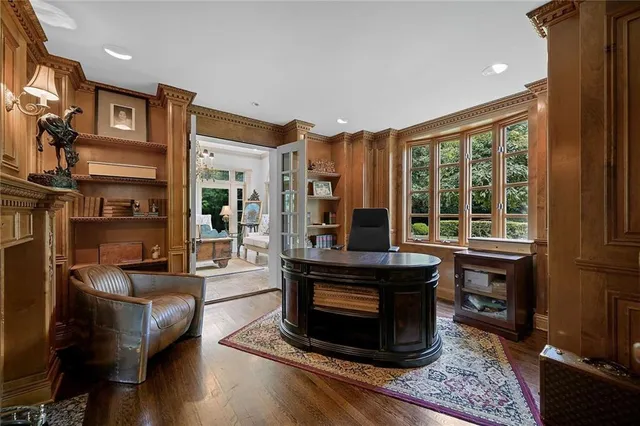 a living room with furniture a window and a fireplace