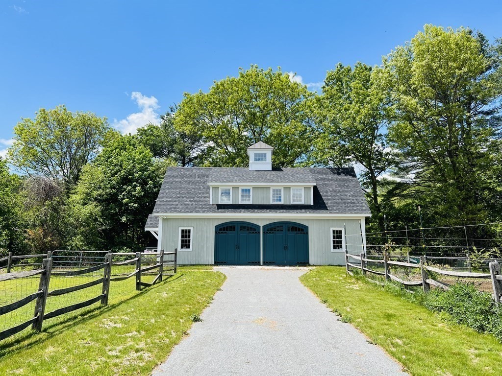 19 Main Street Boxford, MA 01921 - Photo 11 of 25 a front view of a house with a yard