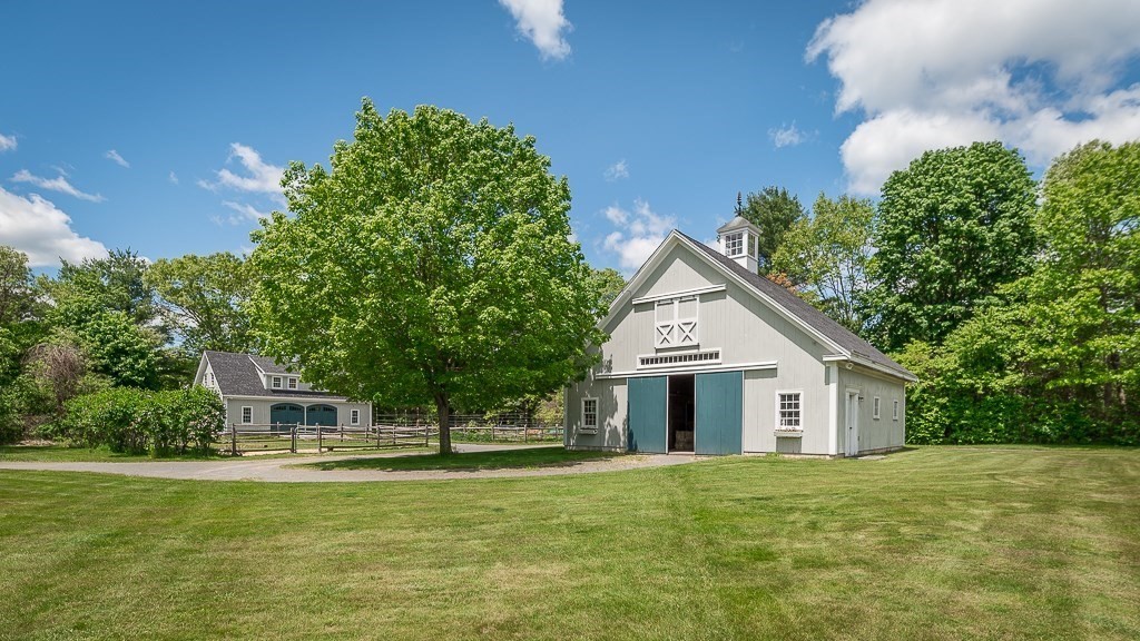 19 Main Street Boxford, MA 01921 - Photo 23 of 25 a house with a big yard and large trees