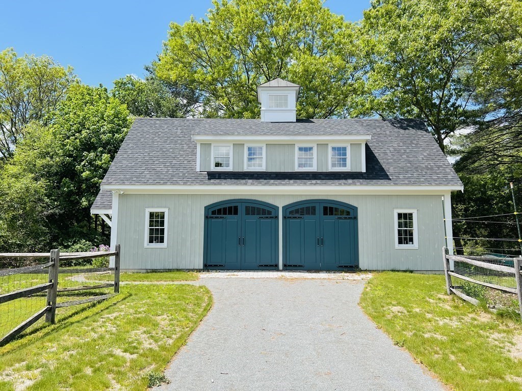 19 Main Street Boxford, MA 01921 - Photo 3 of 25 a front view of a house with a yard