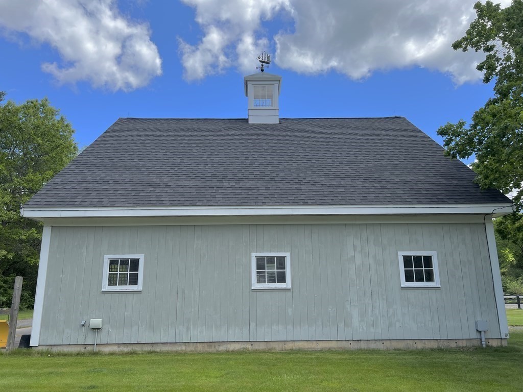 19 Main Street Boxford, MA 01921 - Photo 10 of 25 a house view with a swimming pool