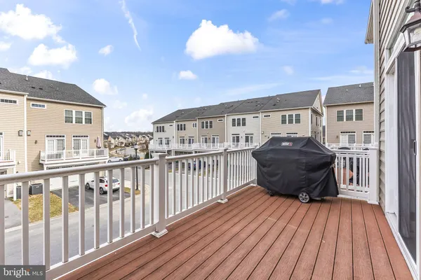 a view of a balcony with wooden floor