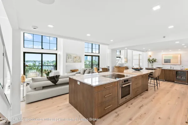 a large kitchen with stainless steel appliances lots of counter top space